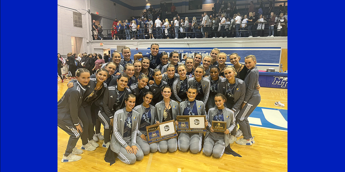 Bruinettes dance team posing with trophies